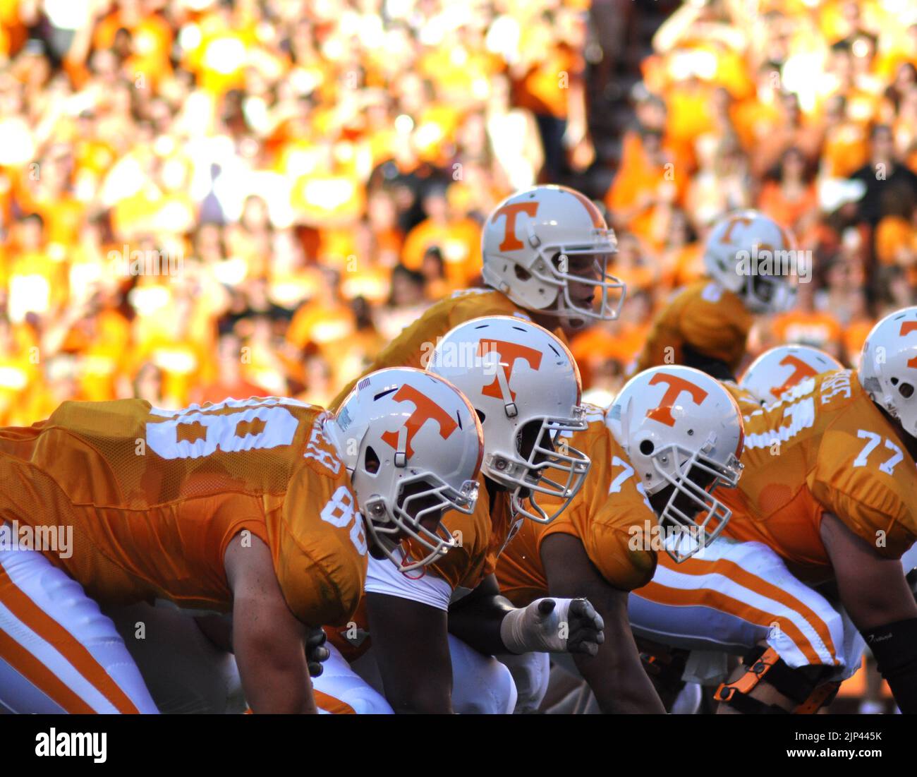 The University of Tennessee offense gathers at the line of scrimmage just moments before the snap of the ball. Stock Photo