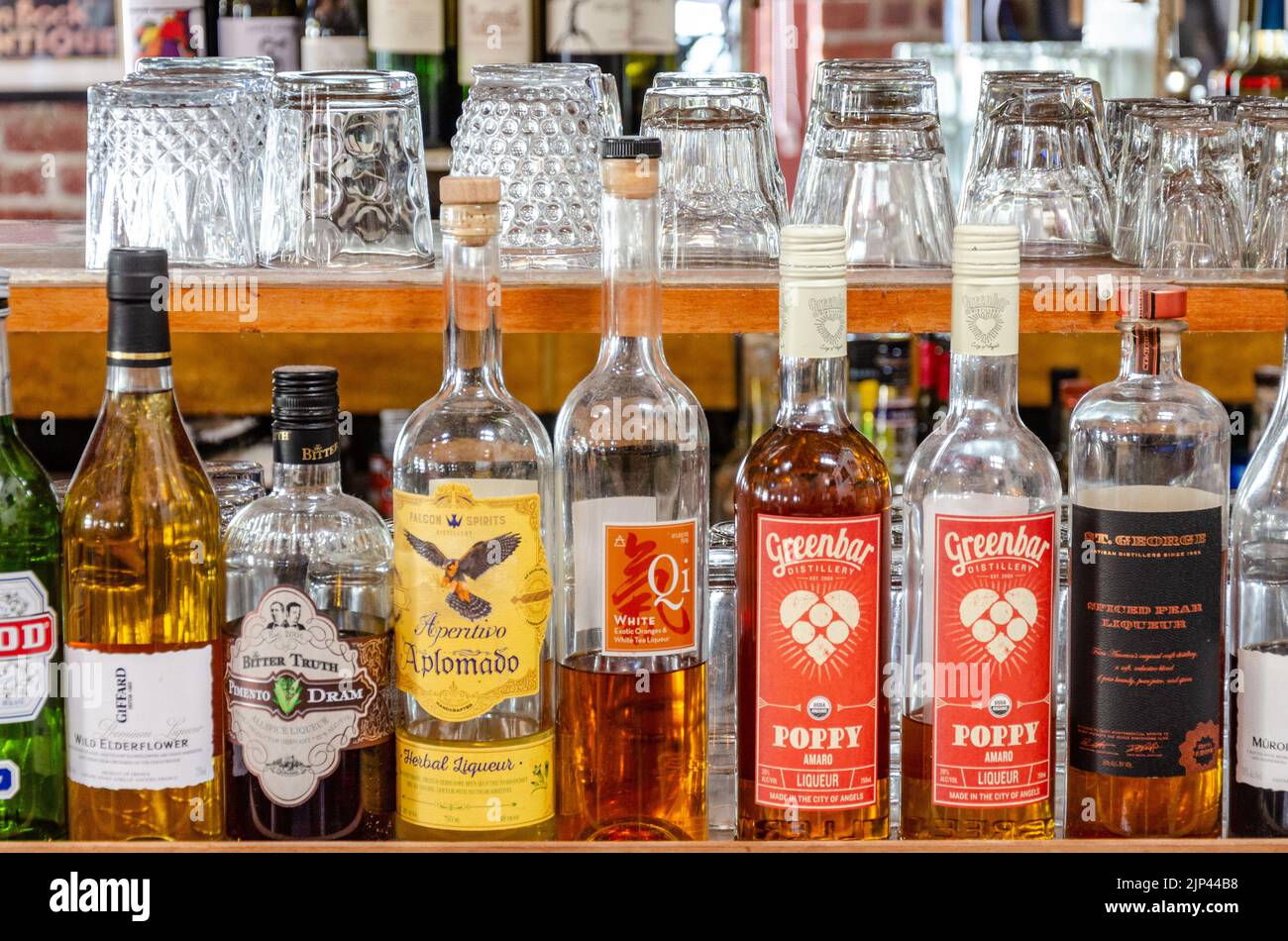 Bottles of liquor and alcoholic drinks at a bar in California, USA Stock Photo