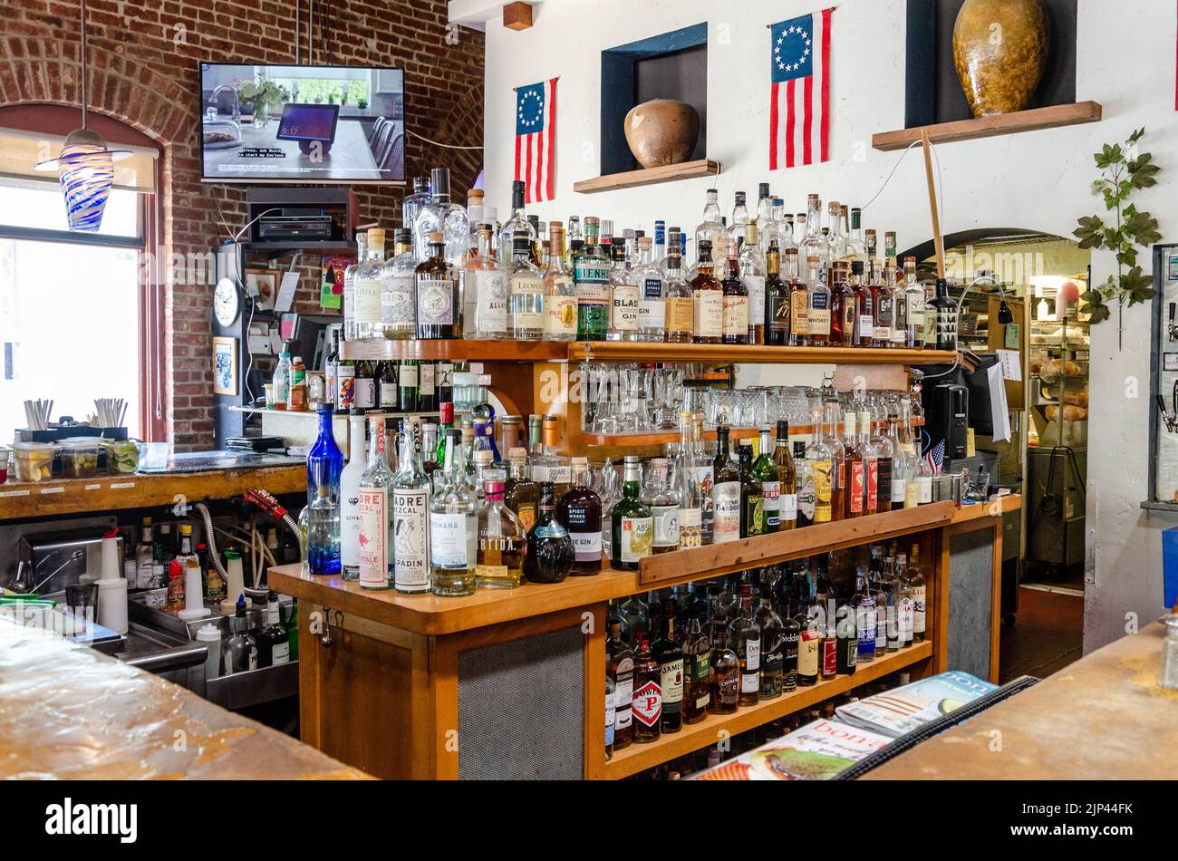 A bar in Calistoga, California with a large array of bottles of liquor in the centre. Stock Photo