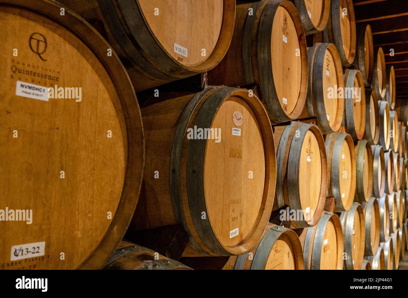 Oak barrels filled with ageing wine at a winery in The Napa Valley, California, USA Stock Photo