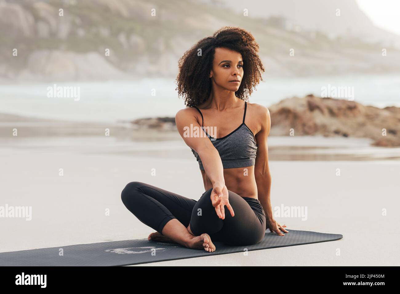 woman-doing-yoga-meditation-young-female-with-crossed-legs-at-sunset
