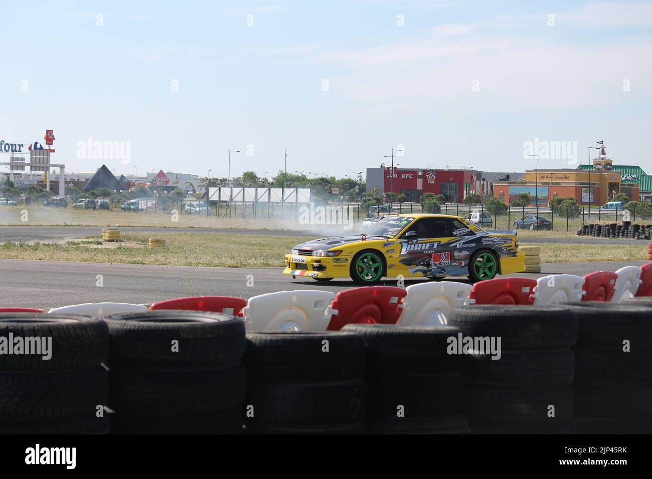 Futuristic sports car drifting in the neon street Stock Photo - Alamy