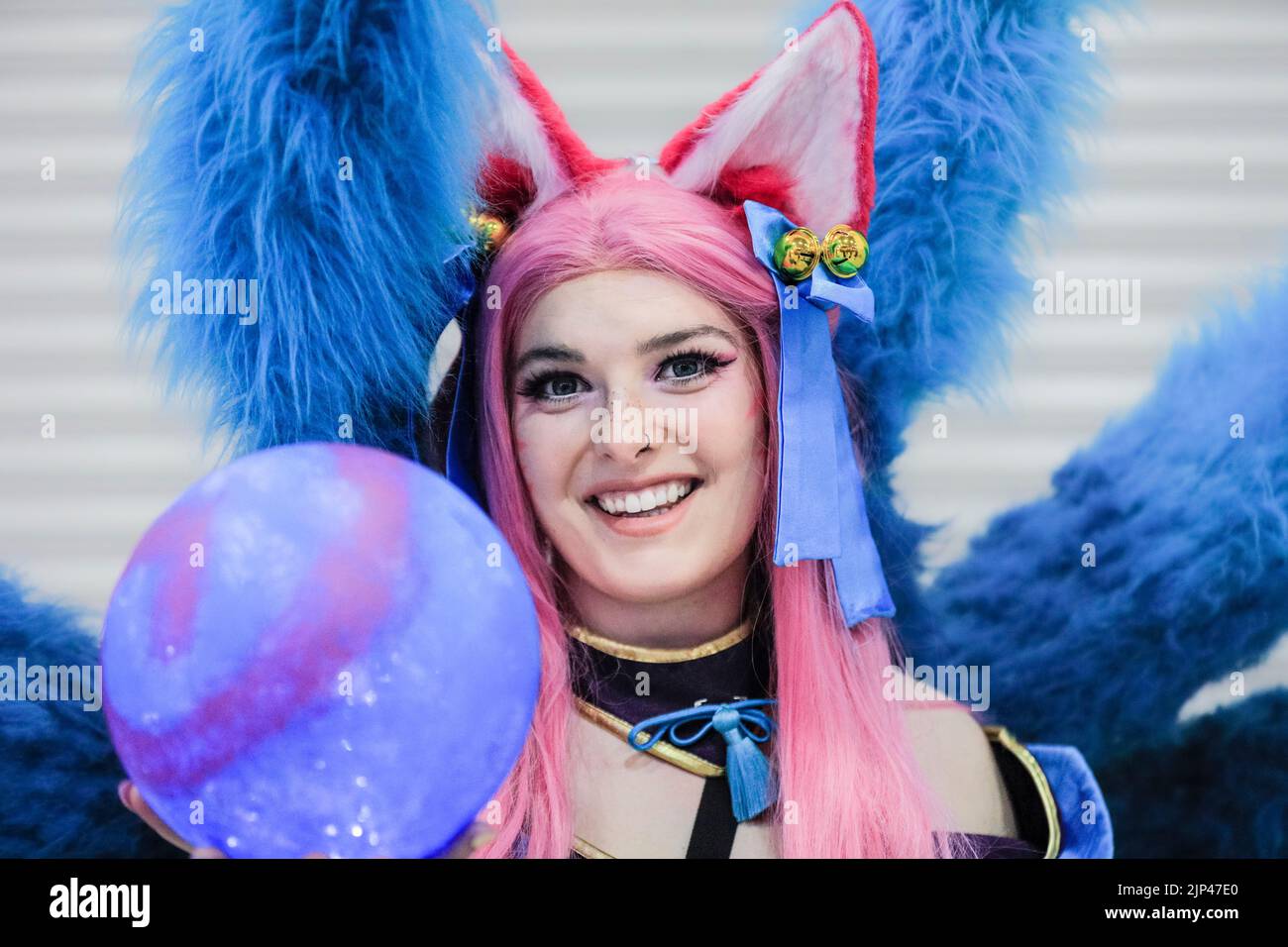 Female cosplayer as Spirit Blossom Ahri from League of Legends, female visitor in costume, Comic Con London Stock Photo