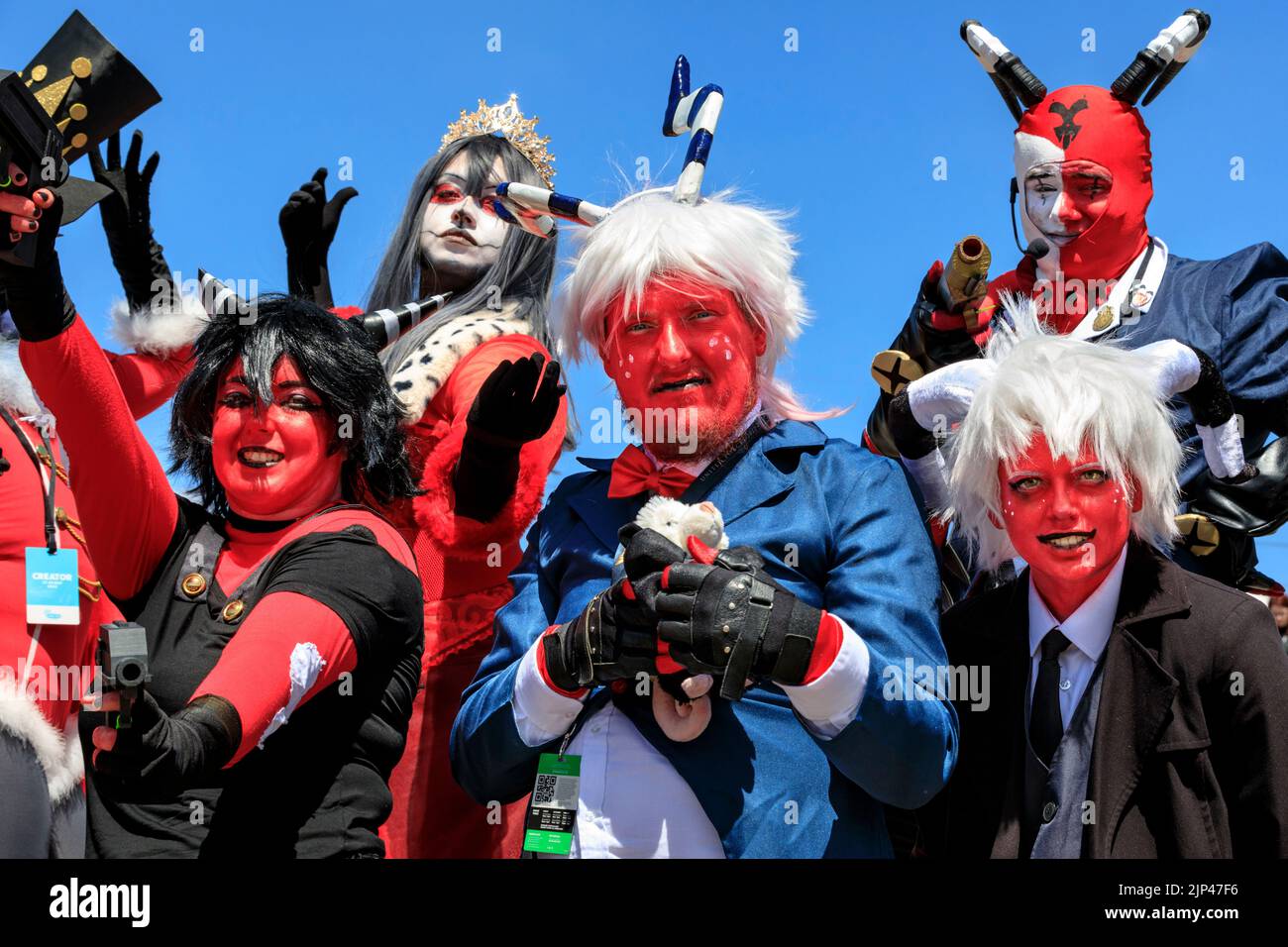 A group cosplayers pse as characters from youtube anime Hell of A Boss, London Comic Con Stock Photo