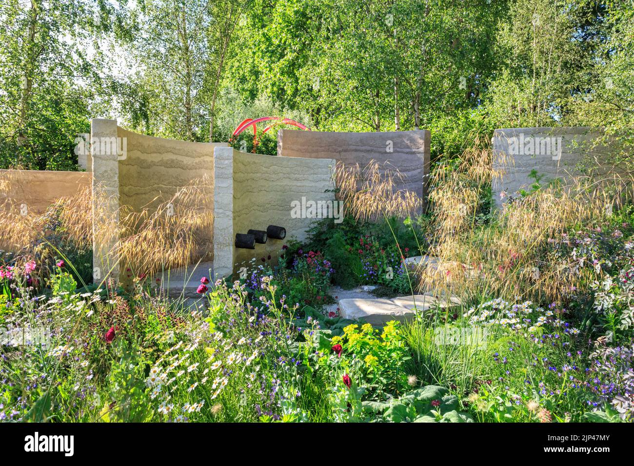 The Mind Garden, designed by Andy Sturgeon, sculptural walls and colourful meadow, Chelsea Flower Show 2022, London Stock Photo