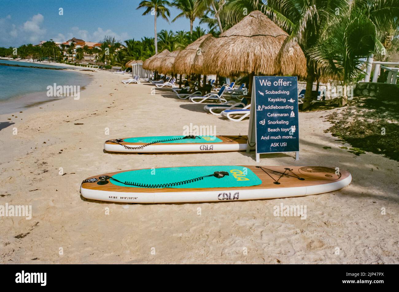 Surfboards for use at the beach of Puerto Aventuras, Quintana Roo, Mexixo in summer of 2022. Stock Photo