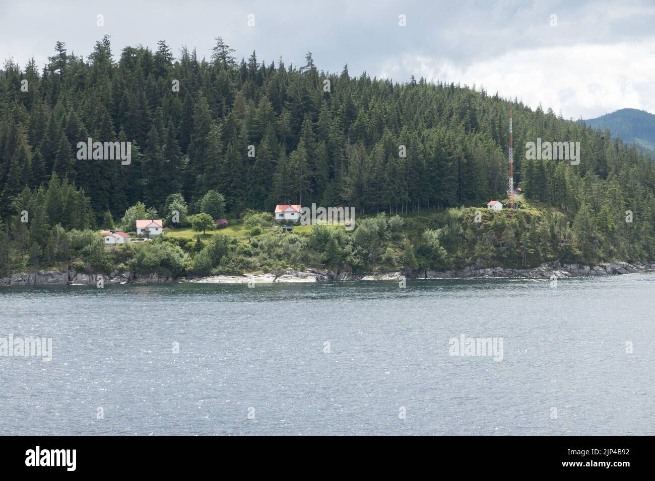 The historic Chatham Point Lighthouse at intersection of Discovery passage and Johnstone strait Stock Photo