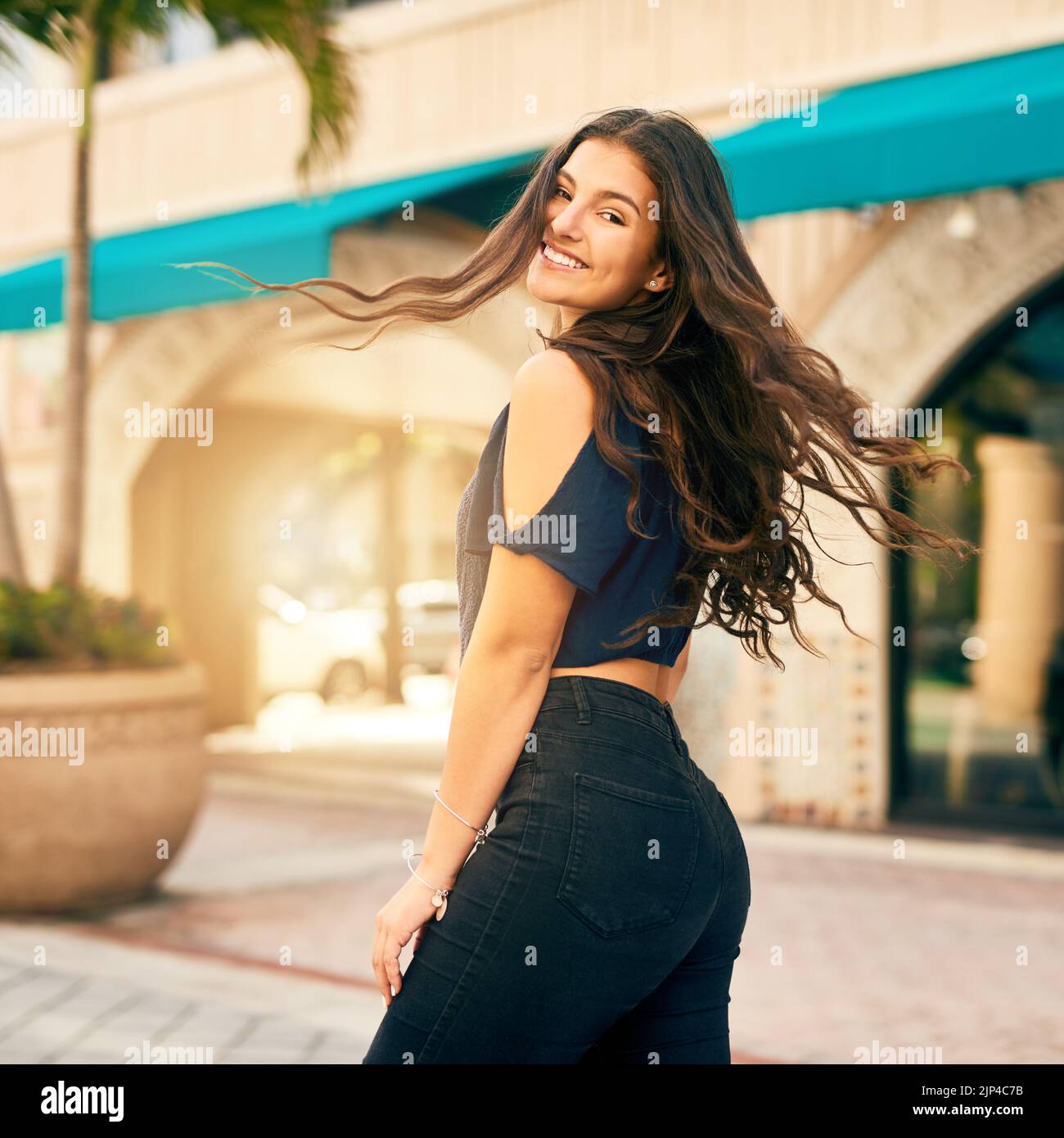 Celebrating life just by being happy. a happy teenage girl in the city. Stock Photo