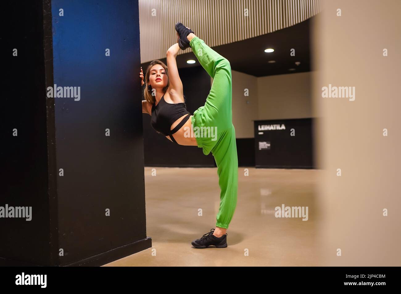 A Vertical Shot Of A Beautiful Caucasian Dancer In A Sporty Outfit 