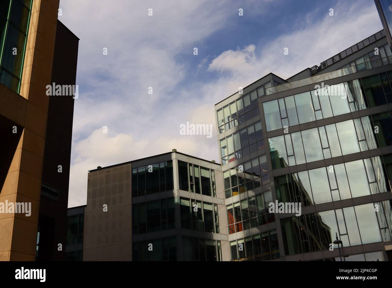 The modern buildings with glassy facades against a cloudy sky Stock ...