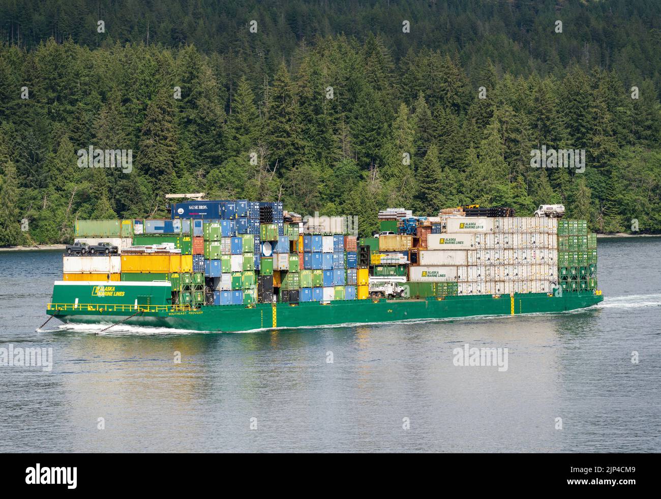 Campbell River, BC - 11 June 2022: Containers stacked on Alaska Marine Lines barge in Discovery Passage Stock Photo