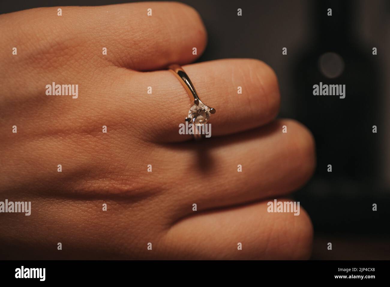 A closeup shot of an engagement ring on a finger Stock Photo Alamy