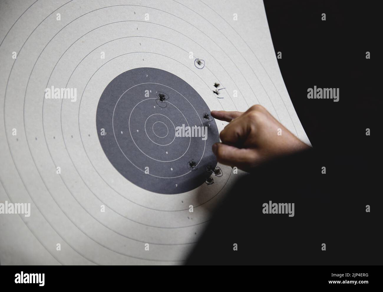 Pistol bullseye target training in a shooting club closeup Stock Photo