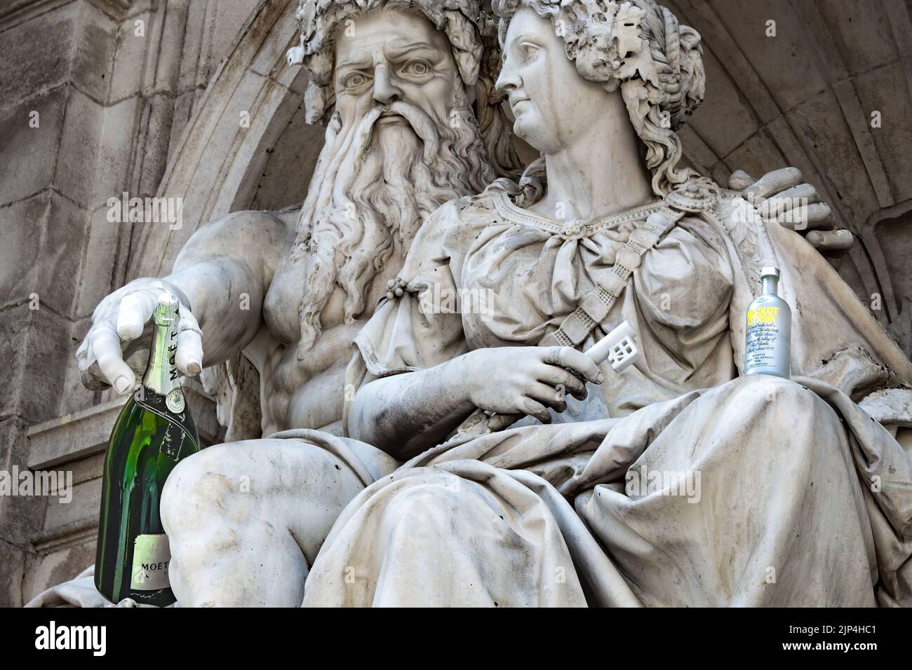 The statue of Zeus and Hera in Albertina Square, Vienna with modern alcohol bottles placed in their reach Stock Photo