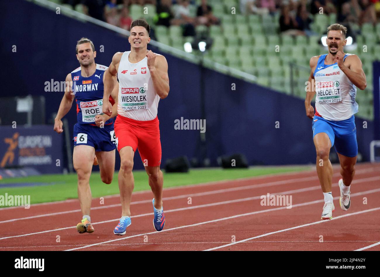 Athletics - 2022 European Championships - Olympiastadion, Munich, Germany - August 15, 2022 Poland's Pawel Wiesiolek and Czech Republic's Adam Helcelet  in action during the men's decathlon 400m heats REUTERS/Wolfgang Rattay Stock Photo