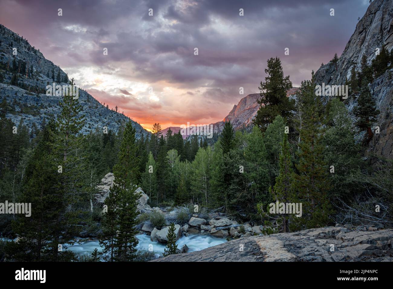 Evolution Creek flowing beneath a beautiful sunset in Kings Canyon ...