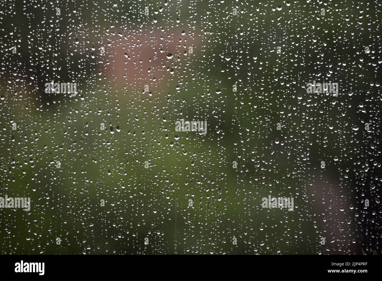 Windowpane Rain Drops of rain run down a window pane after a stoorm in Santa Fe, New ...