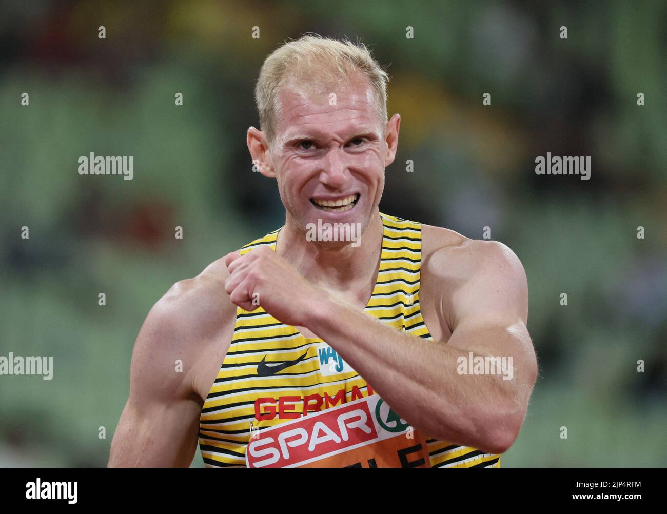 Athletics - 2022 European Championships - Olympiastadion, Munich, Germany - August 15, 2022 Germany's Arthur Abele reacts after his men's decathlon 400m heat REUTERS/Wolfgang Rattay Stock Photo