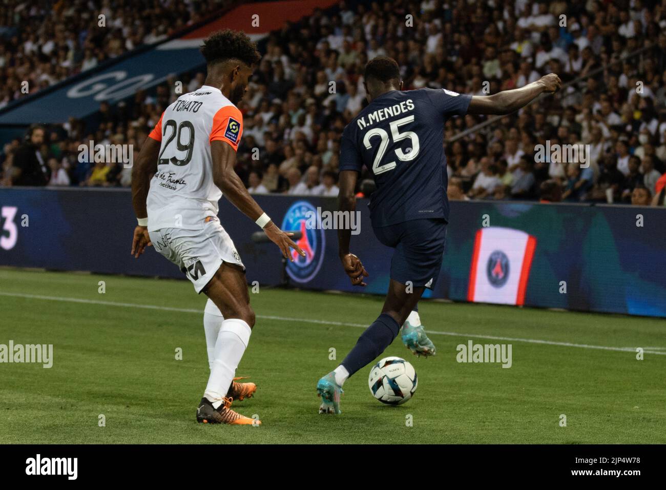 The player Nuno Mendes dancing with the ball against a player of Montpellier Stock Photo