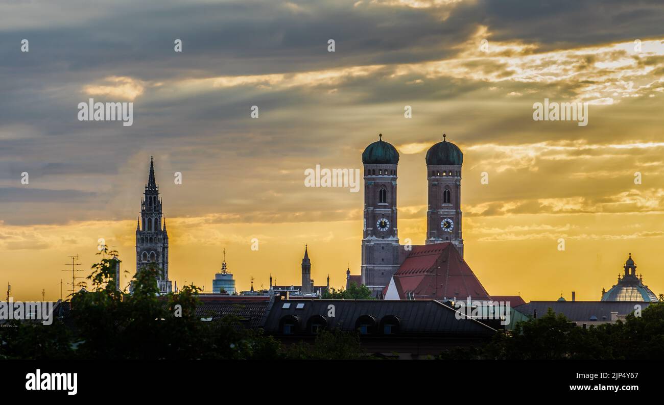 A beautiful shot of the Frauenkirche and other buildings under a golden ...