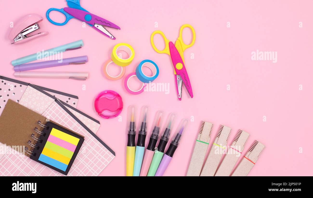 Pastel pink background with Back to school supplies and copy space on ...