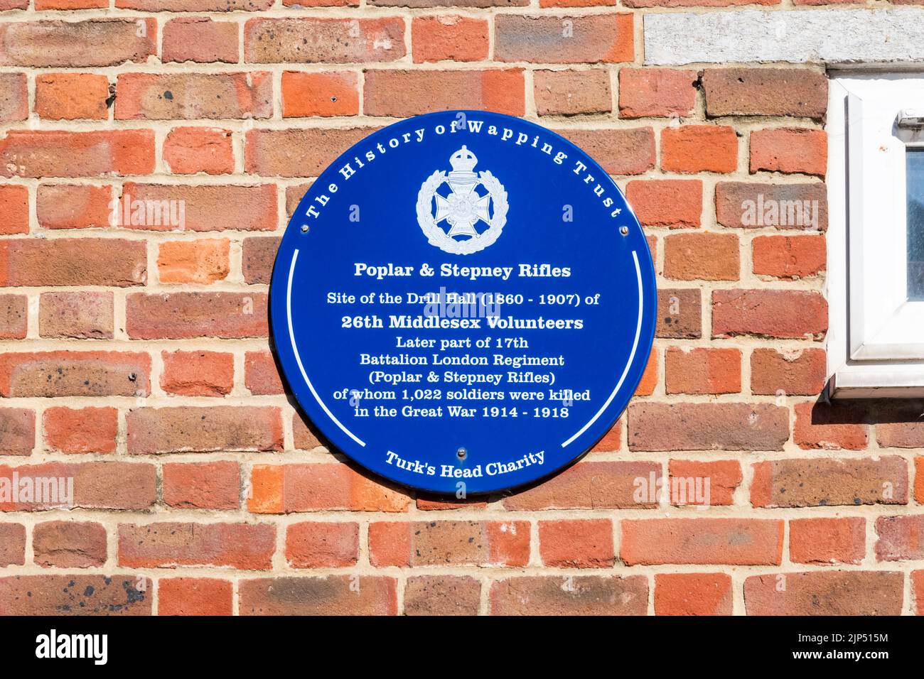A blue plaque in Glamis Road marks the site of the Drill Hall of the Poplar & Stepney Rifles. Stock Photo