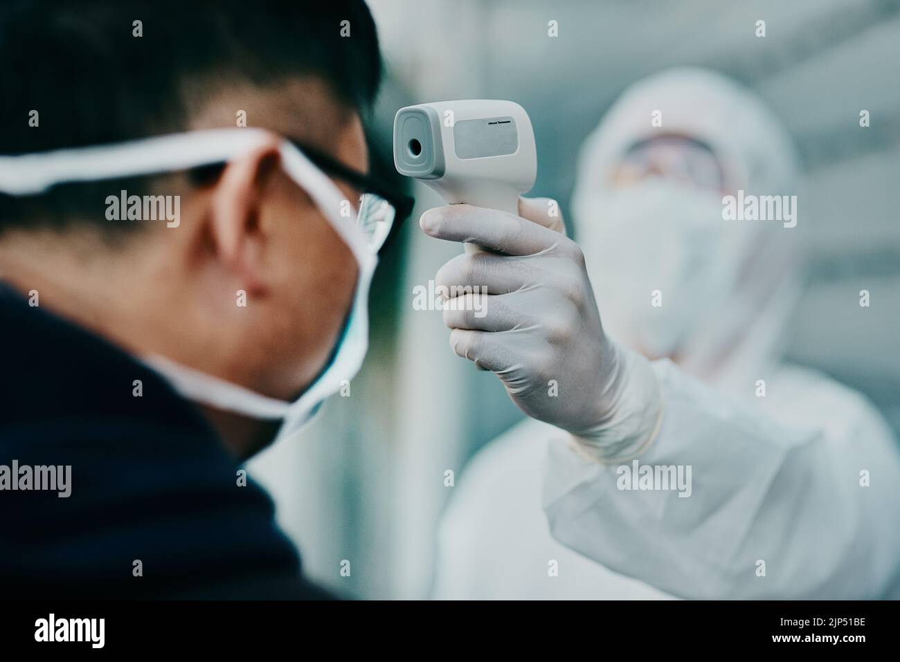 Travel, healthcare and covid temperature testing outside with an