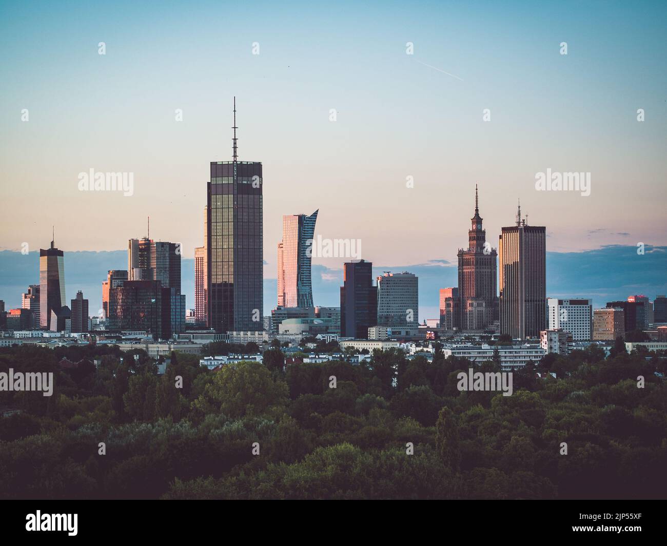 Warsaw city center and Pola Mokotowskie park at dusk aerial view Stock Photo