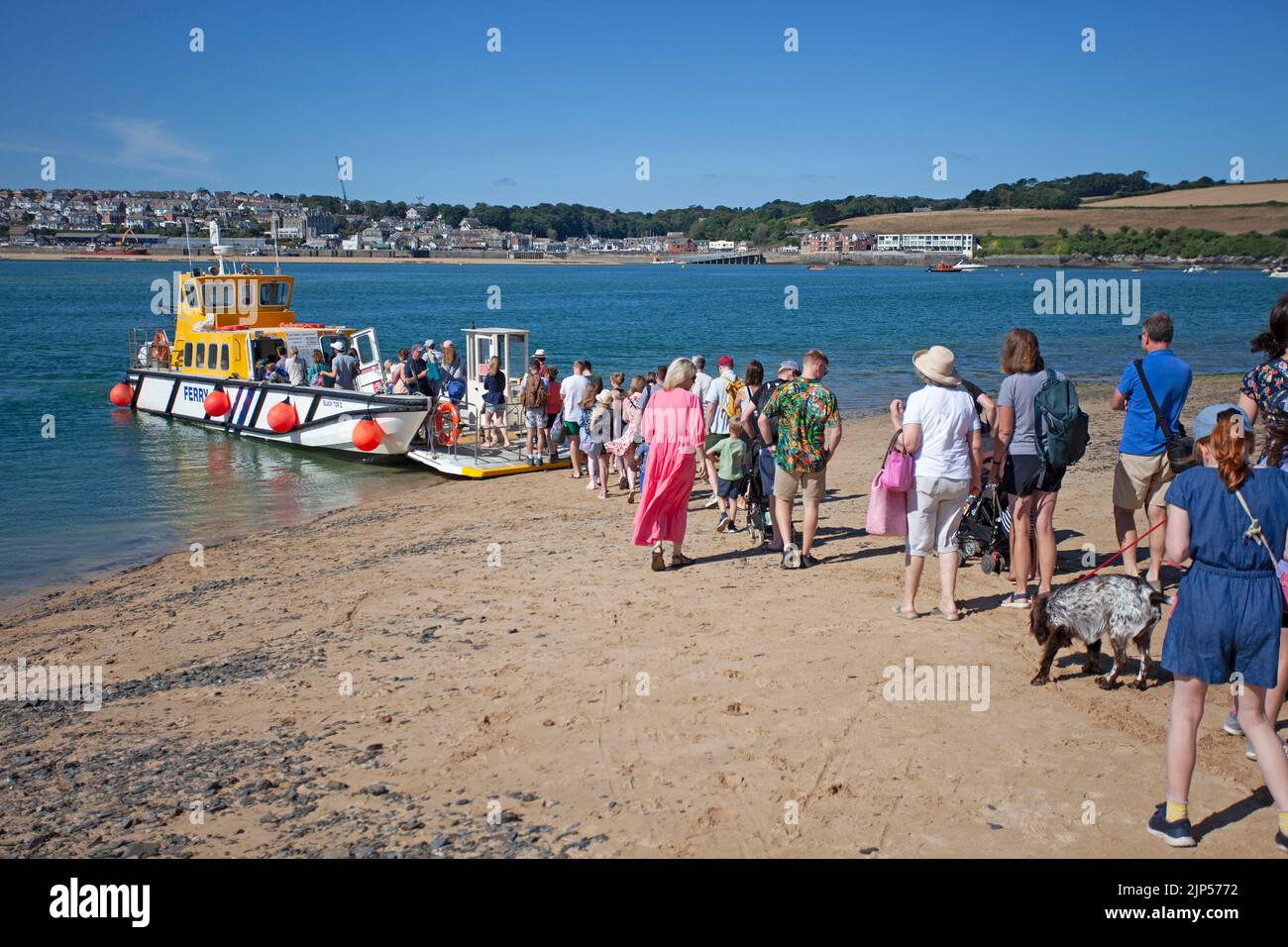 People waiting to board Padstow to Rock Ferry. Cornwall, England Stock Photo