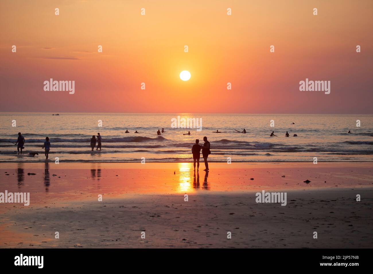 People watching the sunset. Polzeath Beach. Cornwall, England Stock Photo