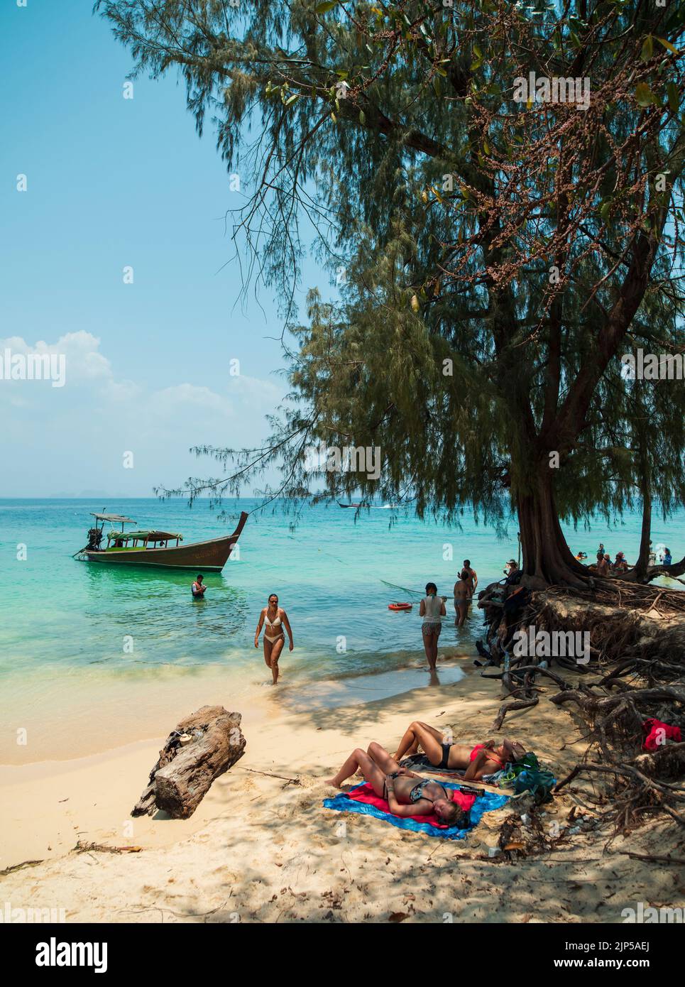 Beach on Koh Kradan Island in the Andaman Sea. Traditional Thai boats