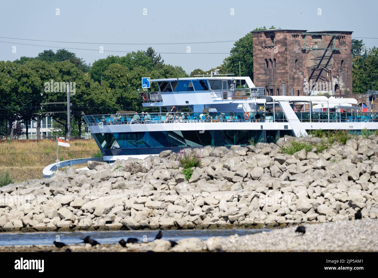 Cologne, Germany, August 10 2022: an excursion boat on the almost dry rhine near cologne Stock Photo