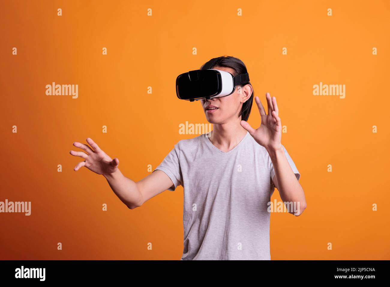 Man wearing vr headset playing virtual reality games, exploring