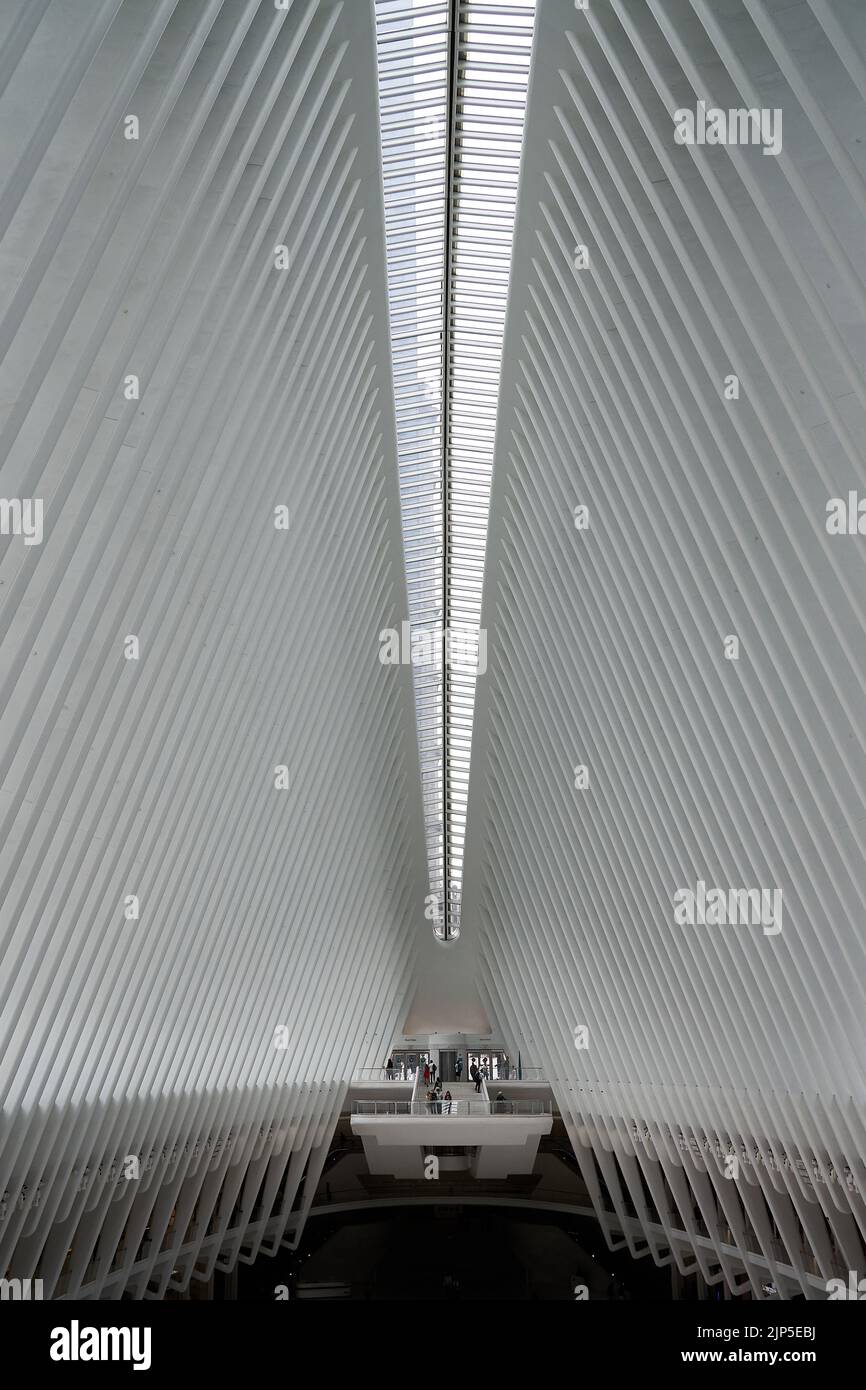 A vertical shot of the Oculus building in Manhattan with perfectly symmetric architecture inside Stock Photo