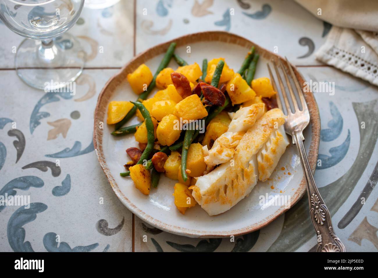 Spanish dish of cod with potato and chorizo Stock Photo