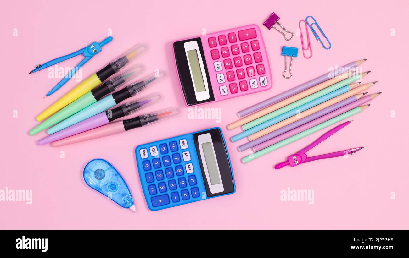 Creative back to school layout with school stationery on pastel pink ...