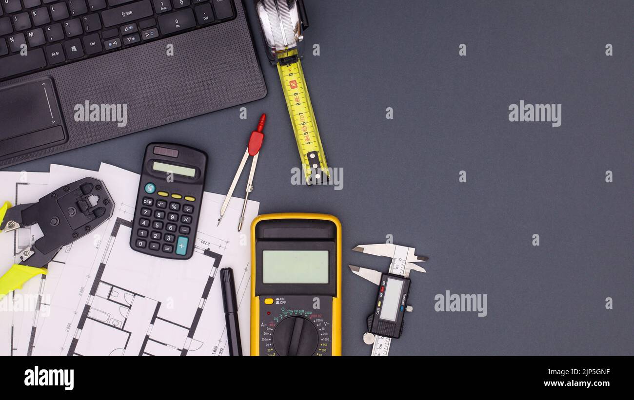 Architecture and business table with plans and construction tools. Flat lay copy space Stock Photo