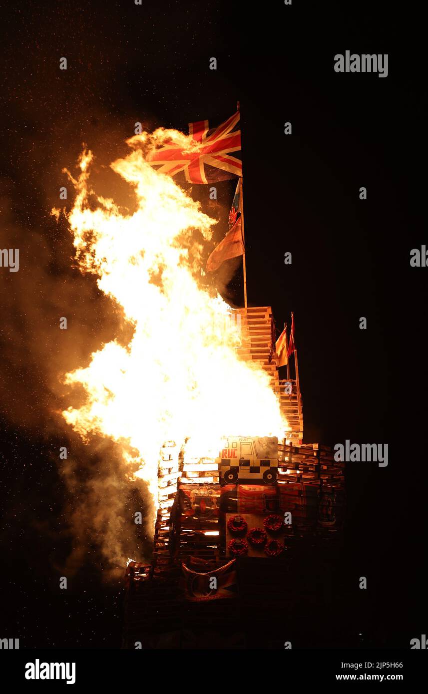 The burning of a bonfire to mark the Catholic Feast of the Assumption in the Bogside area of Londonderry, Northern Ireland. Picture date: Monday August 15, 2022. Stock Photo