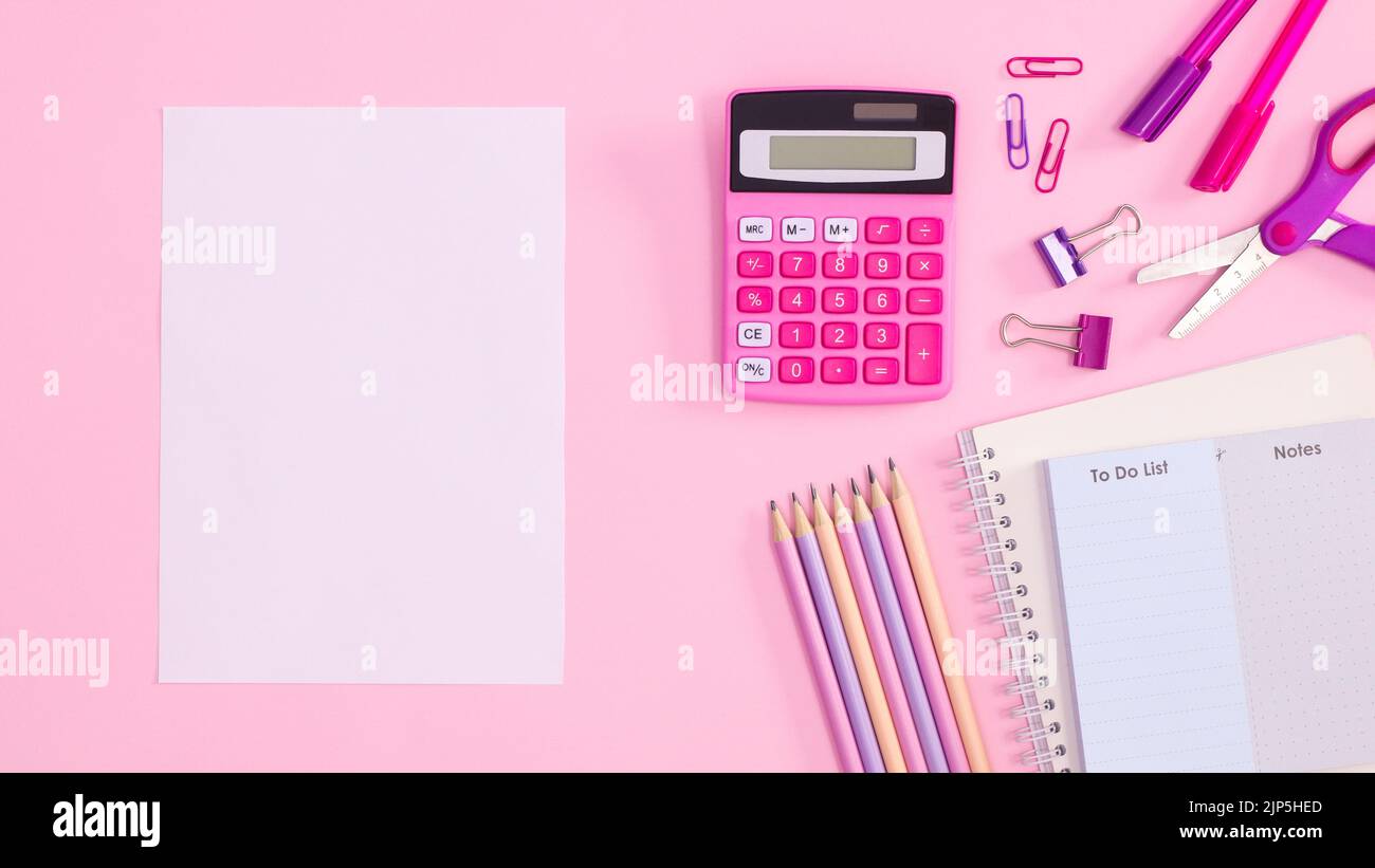Back to school pastel pink background with school supplies and paper ...