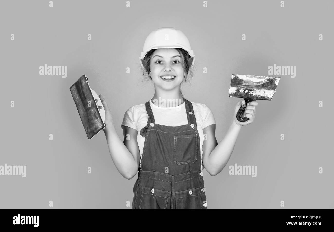 This is my place. kid wear helmet on construction site. teen girl