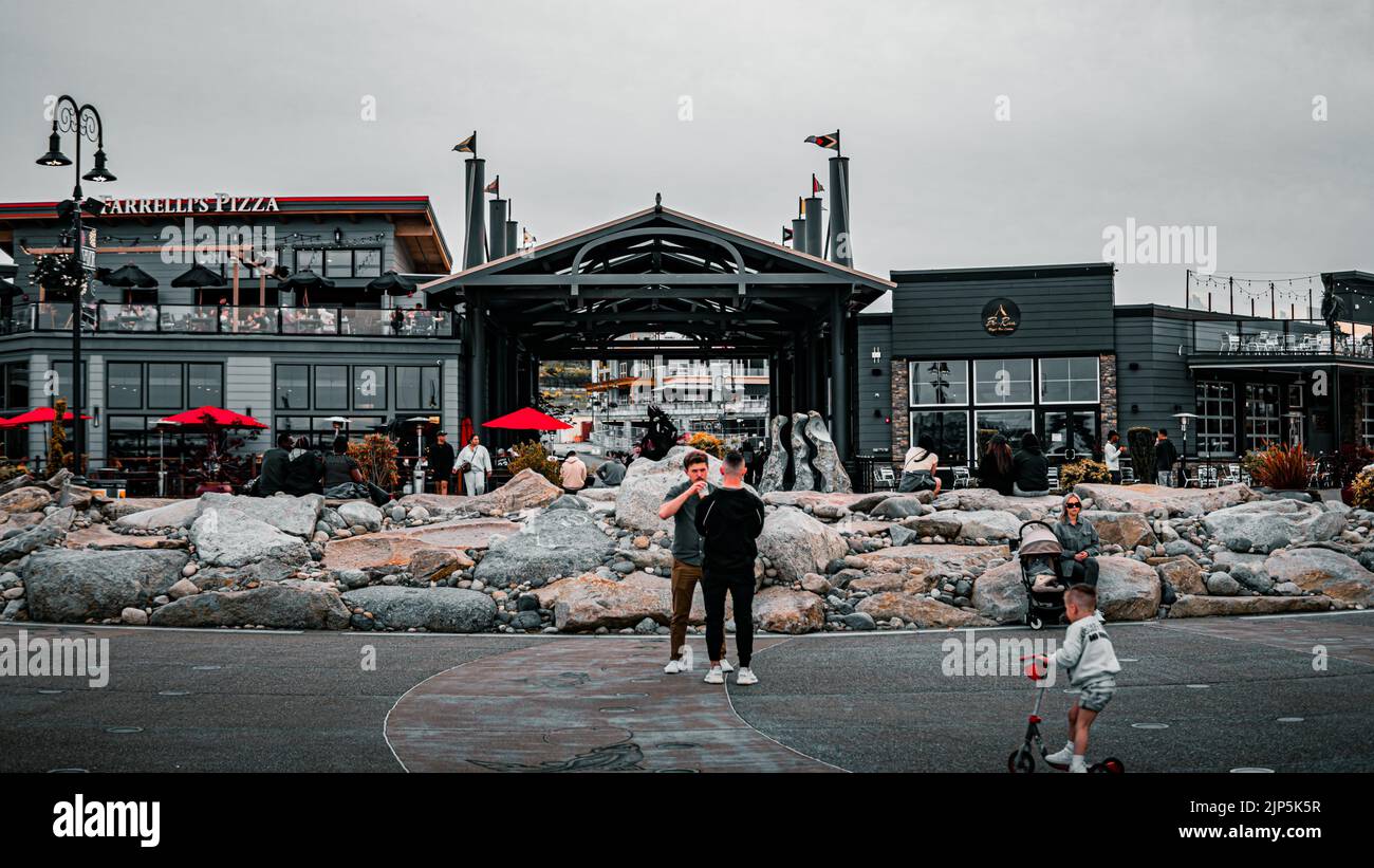 A beautiful view of people on a square in the Point Ruston Stock Photo