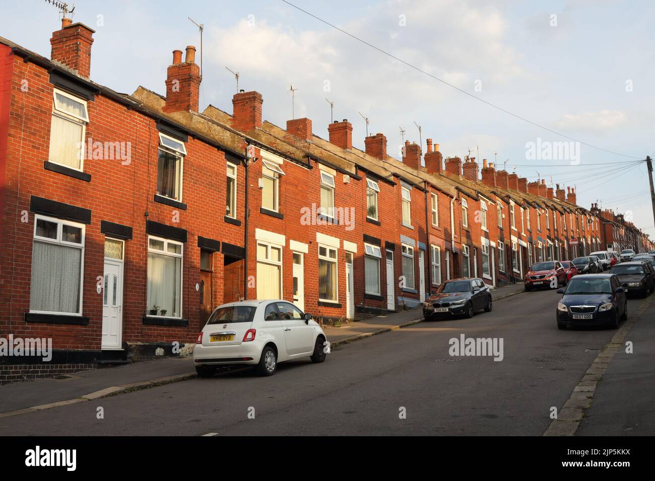Steep Cartmell road, residential road of terraced houses, Sheffield England. Street view Stock Photo