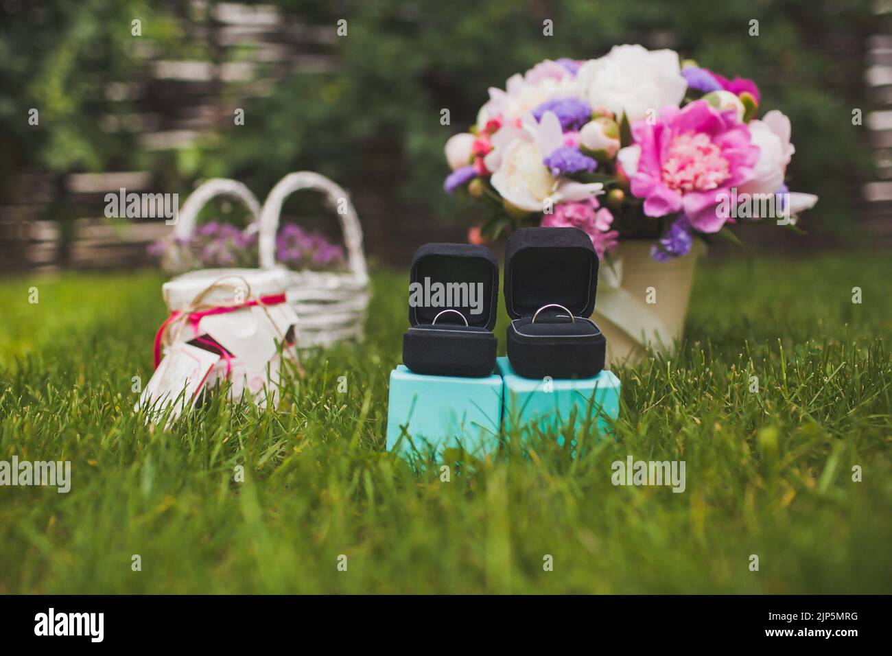 Wedding rings on in grass hi-res stock photography and images - Alamy