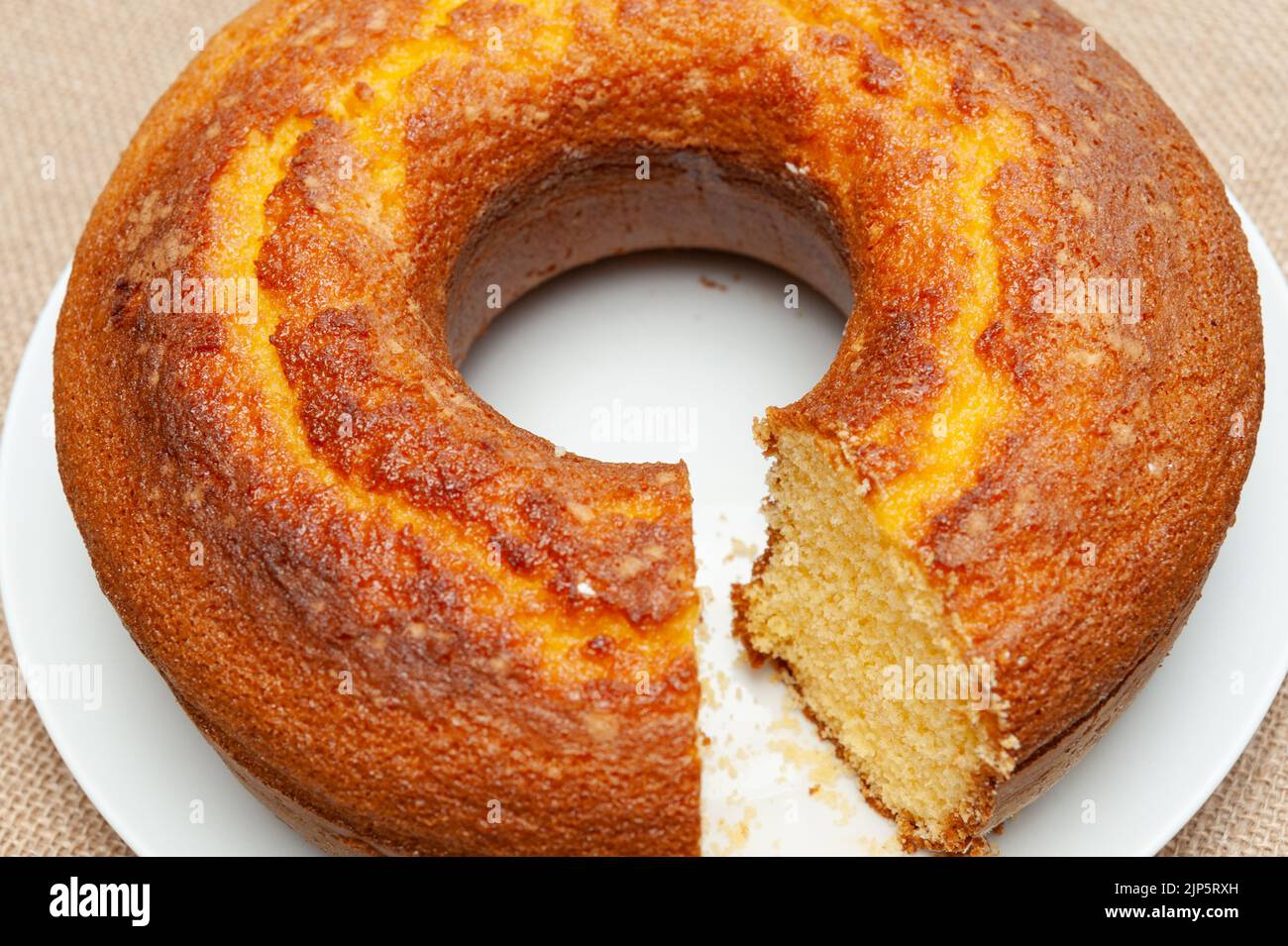 Cornmeal Cake (Bolo de Fuba) cut Brazilian style on a white plate
