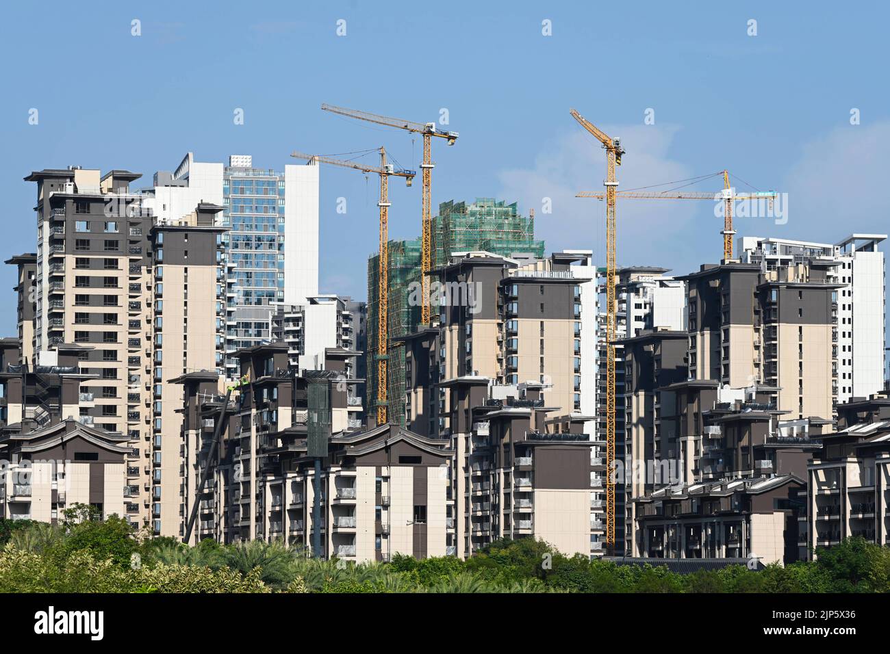 NANNING, CHINA - AUGUST 15, 2022 - A real estate complex under construction is seen in an urban area in Nanning, South China's Guangxi Zhuang autonomo Stock Photo