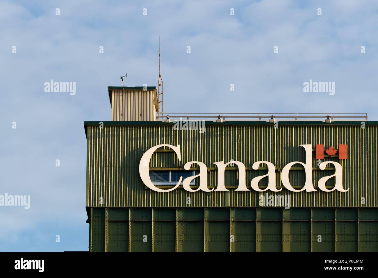 A closeup of the Government of Canada logo on a drawbridge to the entrance of the Port of Hamilton. Stock Photo
