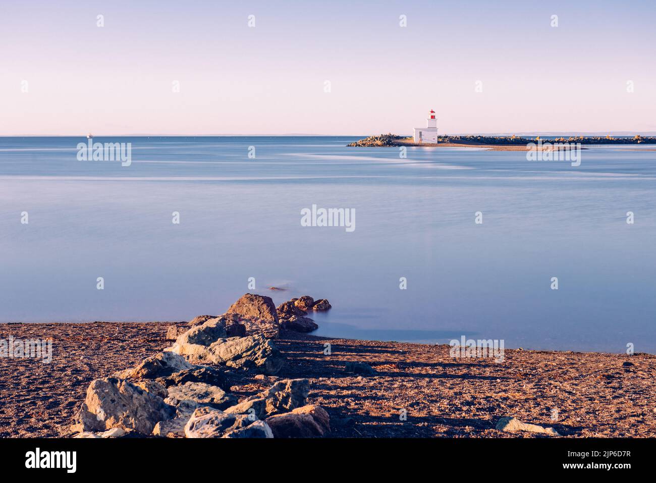 Parrsboro lighthouse watching over Bay of Fundy at high tide Stock Photo