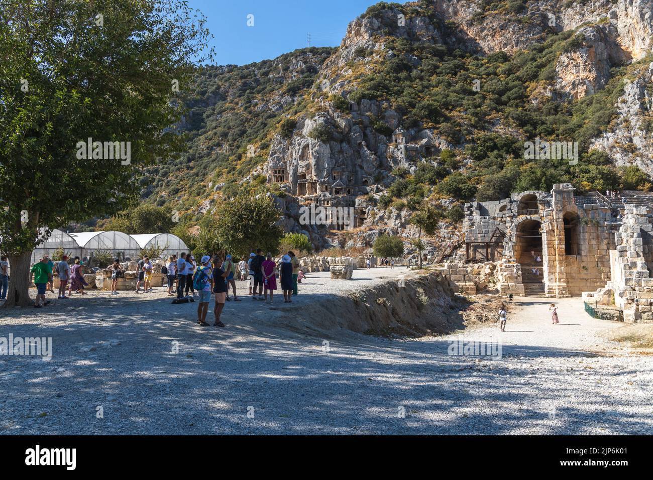 Demre, Antalya Turkey - October 03 2021: Ancient theater at Myra ancient city. Rock-cut tombs Ruins in Lycia region. Stock Photo