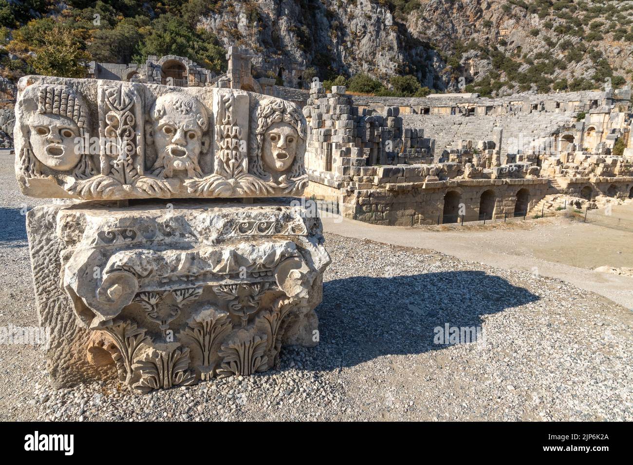 Historical Stone faces and ancient theater at Myra ancient city. Rock-cut tombs Ruins in Lycia region, Demre, Antalya, Turkey. Stock Photo