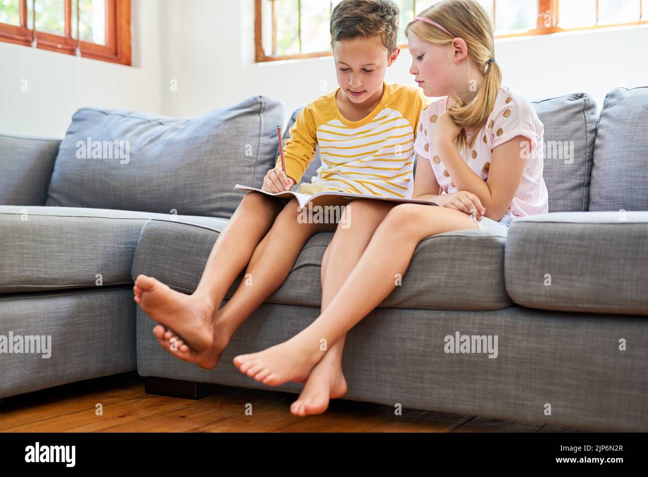 Doing homework is better when we do it together. an adorable brother ...